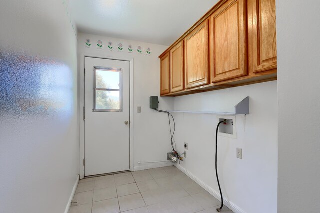 42177 Lone Olive Ln, Ahwahnee, CA 93601 - laundry room featuring cabinet space, washer hookup, baseboards, hookup for an electric dryer, and light tile patterned floors