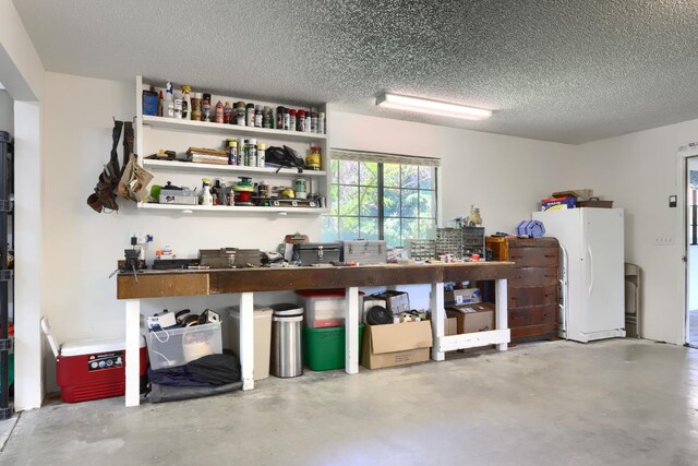 42177 Lone Olive Ln, Ahwahnee, CA 93601 - garage with a workshop area and freestanding refrigerator