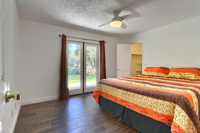 42177 Lone Olive Ln, Ahwahnee, CA 93601 - bedroom with access to outside, dark wood finished floors, a textured ceiling, baseboards, and ceiling fan