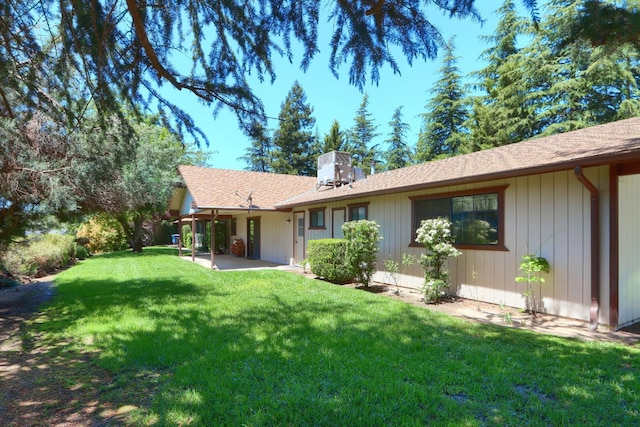 42177 Lone Olive Ln, Ahwahnee, CA 93601 - back of house with a patio area, a yard, and a shingled roof