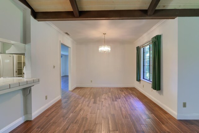 42177 Lone Olive Ln, Ahwahnee, CA 93601 - unfurnished dining area with wood finished floors, a chandelier, beam ceiling, and baseboards