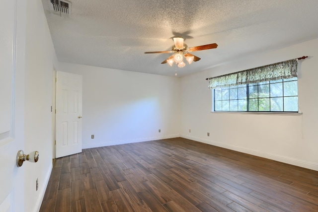 42177 Lone Olive Ln, Ahwahnee, CA 93601 - spare room with a ceiling fan, a textured ceiling, dark wood-style flooring, and baseboards