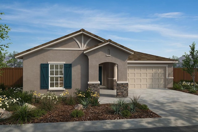 2173 Sylmar Ave, Fresno, CA 93725 - view of front facade featuring stucco siding, fence, a garage, driveway, and stone siding