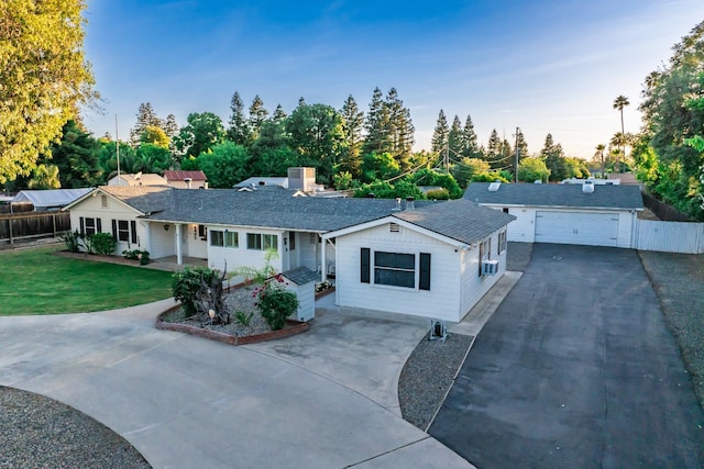 ranch-style home featuring driveway and a garage