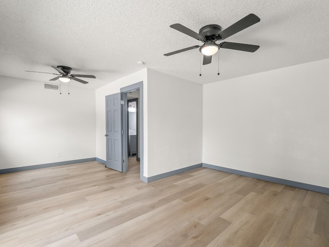 4038 W San Jose Ave, Fresno, CA 93722 - unfurnished room featuring a ceiling fan, a textured ceiling, light wood-type flooring, and baseboards