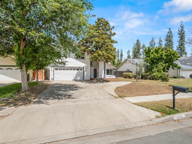 4038 W San Jose Ave, Fresno, CA 93722 - view of front of house featuring a garage and driveway