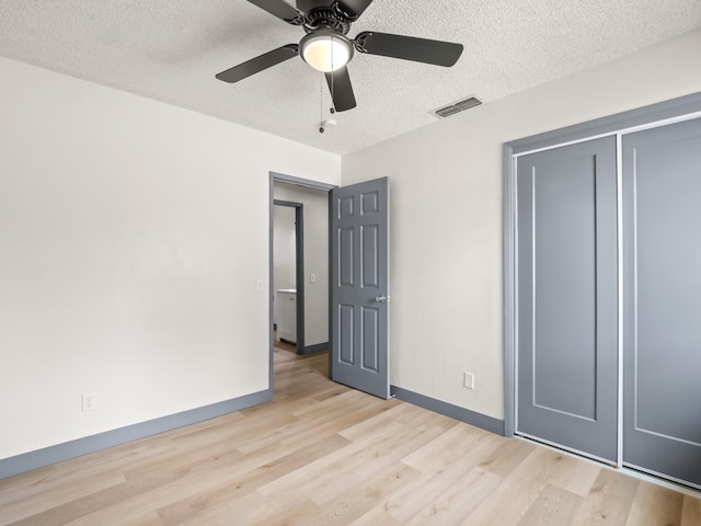 4038 W San Jose Ave, Fresno, CA 93722 - unfurnished bedroom featuring light wood-style flooring, baseboards, a textured ceiling, ceiling fan, and a closet