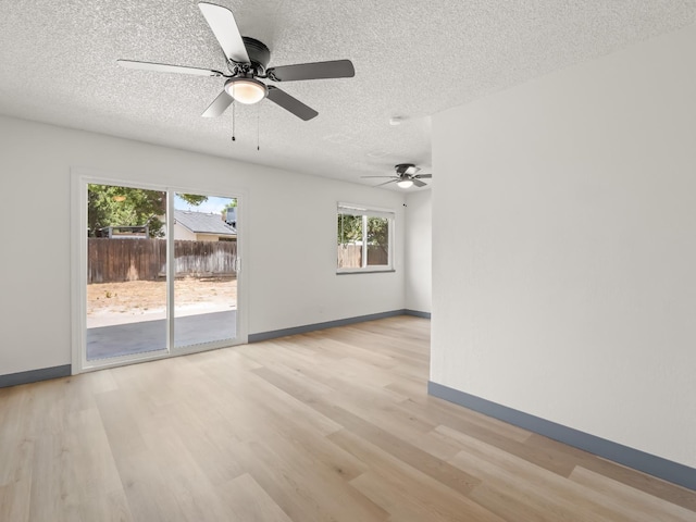 4038 W San Jose Ave, Fresno, CA 93722 - empty room featuring a textured ceiling, light wood finished floors, ceiling fan, and baseboards
