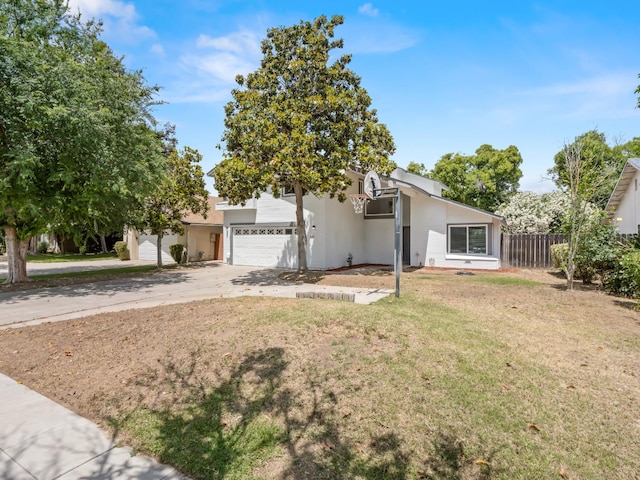 4038 W San Jose Ave, Fresno, CA 93722 - view of front of property with driveway and a garage