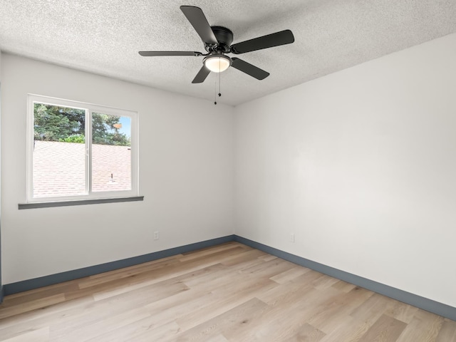 4038 W San Jose Ave, Fresno, CA 93722 - unfurnished room with light wood-style flooring, a textured ceiling, baseboards, and a ceiling fan