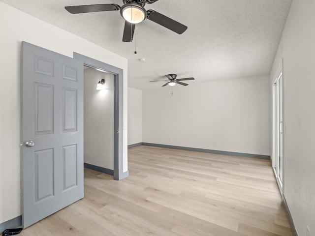 4038 W San Jose Ave, Fresno, CA 93722 - spare room featuring a ceiling fan, light wood finished floors, a textured ceiling, and baseboards