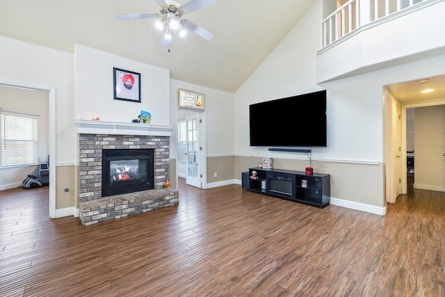 6371 N Babigian Ave, Fresno, CA 93722 - living room featuring a brick fireplace, high vaulted ceiling, a ceiling fan, healthy amount of natural light, and baseboards