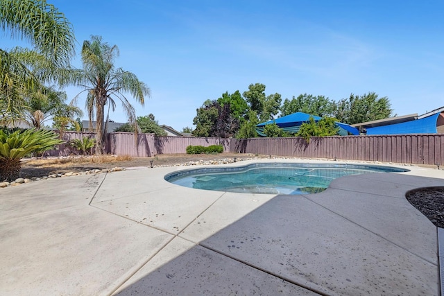 6371 N Babigian Ave, Fresno, CA 93722 - view of pool featuring a patio and a fenced backyard