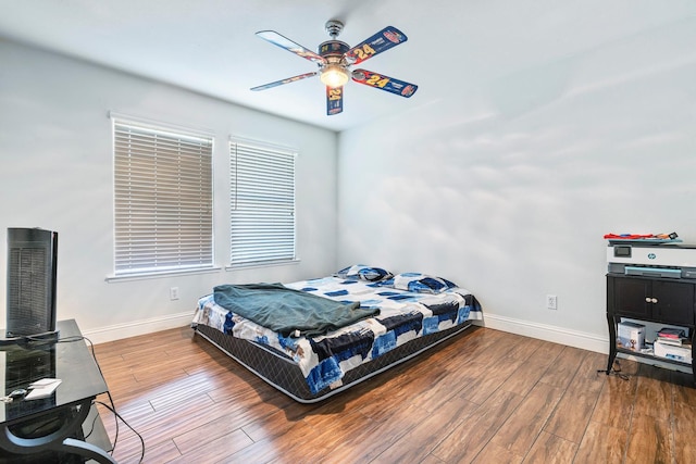 6371 N Babigian Ave, Fresno, CA 93722 - bedroom with baseboards, wood finished floors, and ceiling fan