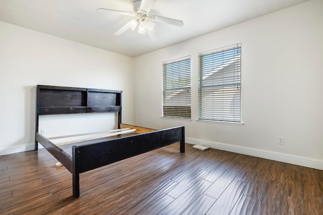 6371 N Babigian Ave, Fresno, CA 93722 - bedroom featuring baseboards, wood finished floors, and ceiling fan