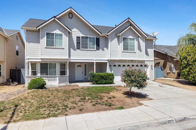 6371 N Babigian Ave, Fresno, CA 93722 - view of property featuring a porch, an attached garage, driveway, and fence