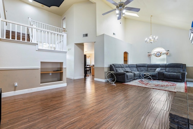 6371 N Babigian Ave, Fresno, CA 93722 - living room with a ceiling fan, wood finished floors, baseboards, and high vaulted ceiling