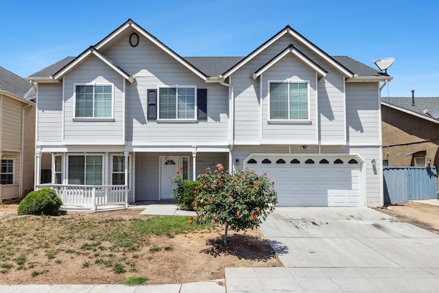 6371 N Babigian Ave, Fresno, CA 93722 - view of front of house featuring a porch, an attached garage, driveway, and fence