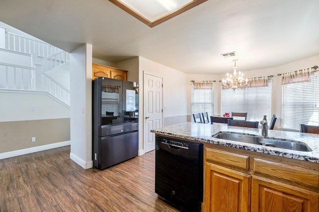 6371 N Babigian Ave, Fresno, CA 93722 - kitchen featuring dishwasher, a sink, dark wood finished floors, a chandelier, and light stone counters