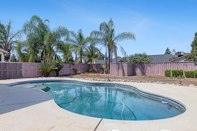 6371 N Babigian Ave, Fresno, CA 93722 - view of swimming pool featuring a fenced backyard and a patio