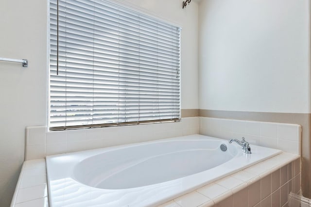 6371 N Babigian Ave, Fresno, CA 93722 - bathroom with a bath and plenty of natural light