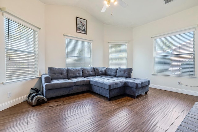 6371 N Babigian Ave, Fresno, CA 93722 - living room with a ceiling fan, vaulted ceiling, wood finished floors, plenty of natural light, and baseboards