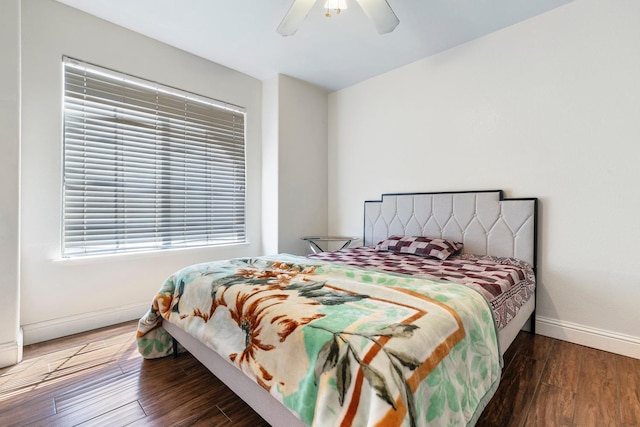 6371 N Babigian Ave, Fresno, CA 93722 - bedroom with baseboards, wood finished floors, and a ceiling fan