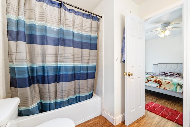 6371 N Babigian Ave, Fresno, CA 93722 - ensuite bathroom with wood finished floors, toilet, a ceiling fan, and shower / tub combo