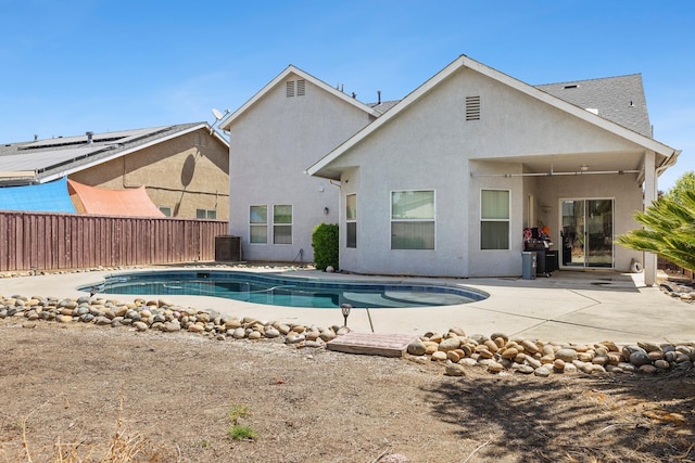 6371 N Babigian Ave, Fresno, CA 93722 - view of swimming pool featuring a fenced backyard, a patio, and cooling unit