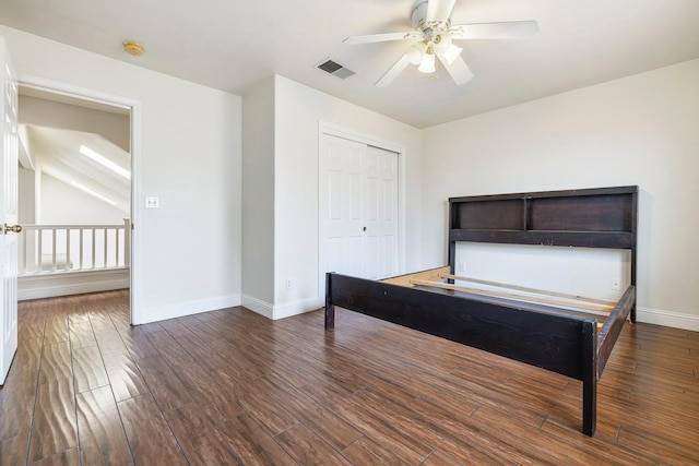 6371 N Babigian Ave, Fresno, CA 93722 - unfurnished bedroom featuring baseboards, wood finished floors, a closet, and ceiling fan