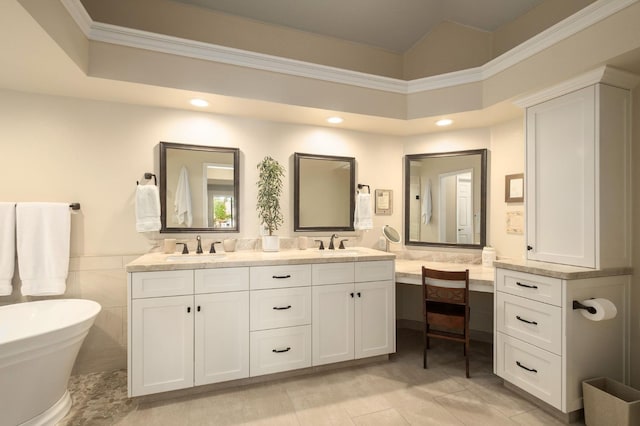 525 E Shelldrake Cir, Fresno, CA 93730 - bathroom with double vanity, a freestanding bath, recessed lighting, a wainscoted wall, and ornamental molding