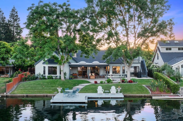 525 E Shelldrake Cir, Fresno, CA 93730 - rear view of property featuring a water view, a patio, and stairway