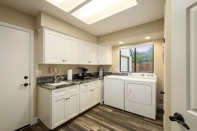 525 E Shelldrake Cir, Fresno, CA 93730 - laundry room with washing machine and clothes dryer, dark wood finished floors, cabinet space, and recessed lighting