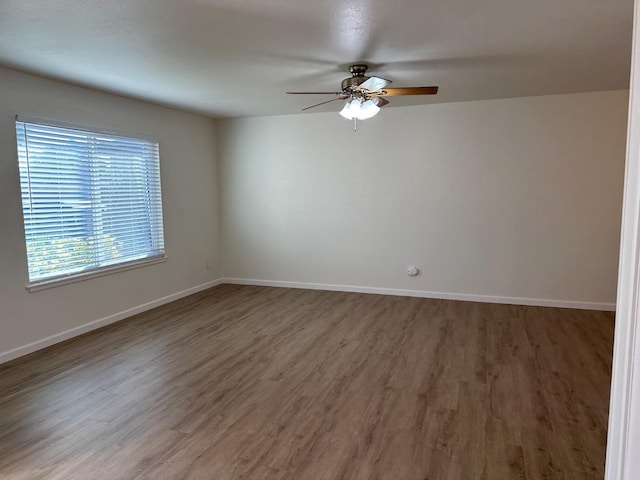 1658 E Paul Ave, Fresno, CA 93710 - unfurnished room featuring ceiling fan, wood finished floors, and baseboards