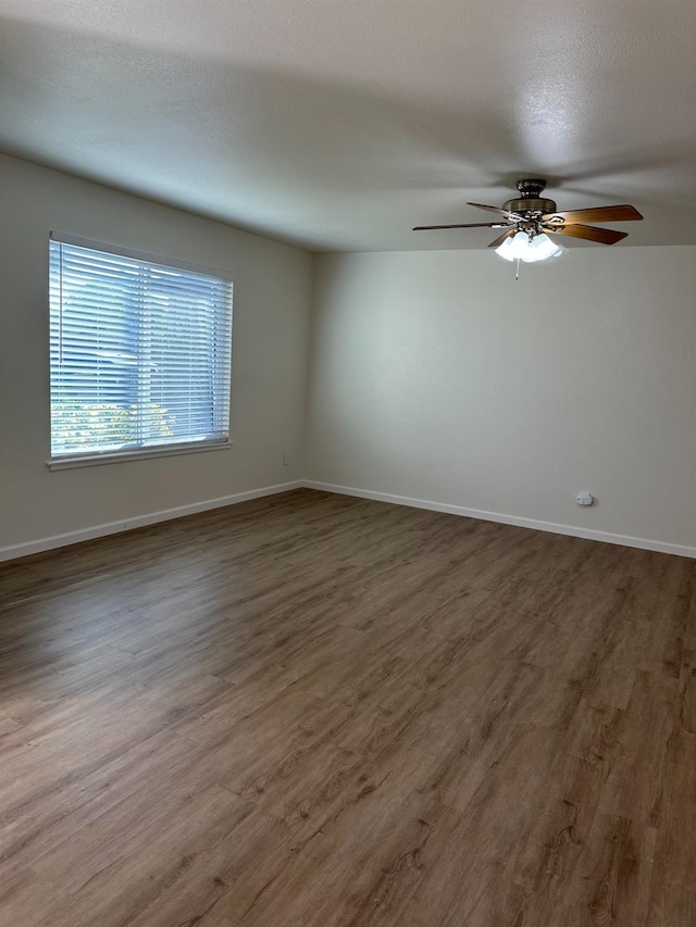 1658 E Paul Ave, Fresno, CA 93710 - unfurnished room with wood finished floors, a ceiling fan, and baseboards