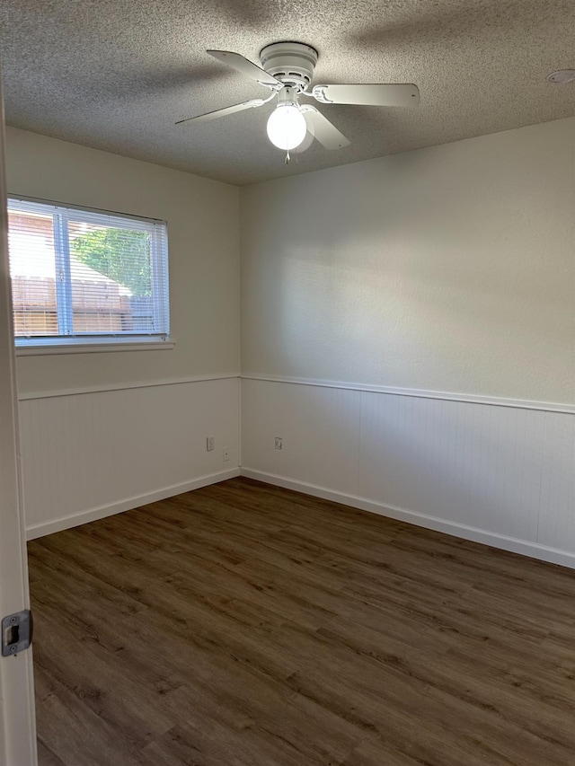 1658 E Paul Ave, Fresno, CA 93710 - spare room with dark wood-style floors, a textured ceiling, and a ceiling fan