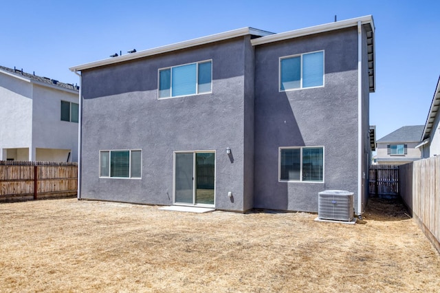 2613 W Mallard, Hanford, CA 93230 - back of house with central AC unit, a fenced backyard, and stucco siding