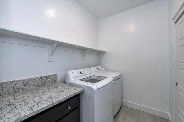 2613 W Mallard, Hanford, CA 93230 - laundry area with washer and dryer, light wood-style flooring, and baseboards