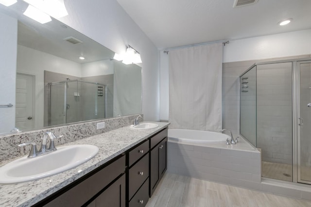 2613 W Mallard, Hanford, CA 93230 - full bath with a shower stall, a bath, double vanity, and wood finished floors