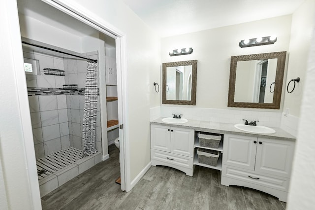 1079 E El Paso Ave, Fresno, CA 93720 - full bath featuring double vanity, wood finished floors, and a tile shower