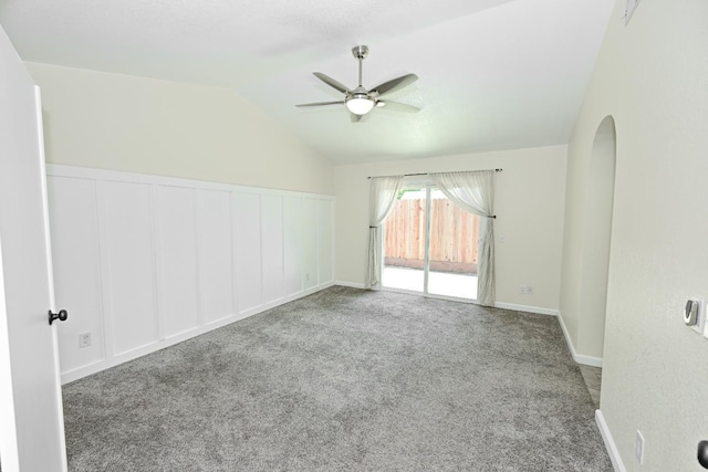 1079 E El Paso Ave, Fresno, CA 93720 - carpeted empty room with a ceiling fan, lofted ceiling, wainscoting, and a decorative wall