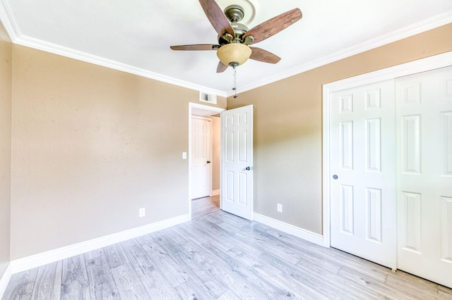 6211 N Cleo Ave, Fresno, CA 93722 - unfurnished bedroom featuring light wood-type flooring, baseboards, ornamental molding, a closet, and a ceiling fan