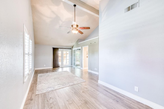 6211 N Cleo Ave, Fresno, CA 93722 - unfurnished room featuring ceiling fan, wood finished floors, high vaulted ceiling, and baseboards