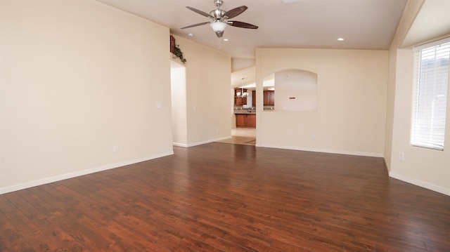 113 Palomino St, Coalinga, CA 93210 - unfurnished living room with ceiling fan, wood finished floors, arched walkways, vaulted ceiling, and recessed lighting