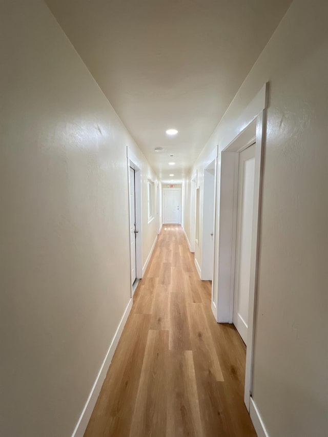 7013 N Maroa Ave, Pinedale, CA 93650 - hall featuring light wood-style floors and baseboards