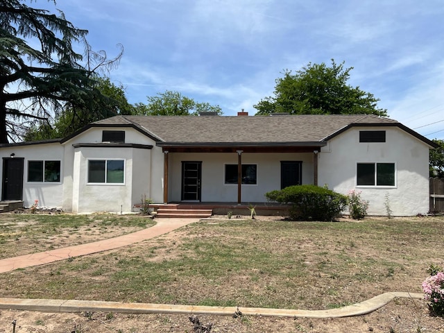 7013 N Maroa Ave, Pinedale, CA 93650 - ranch-style home featuring a porch, stucco siding, a front yard, and roof with shingles