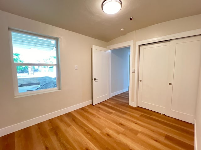 7013 N Maroa Ave, Pinedale, CA 93650 - unfurnished bedroom with light wood-type flooring, baseboards, and a closet