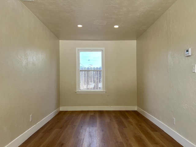 7013 N Maroa Ave, Pinedale, CA 93650 - empty room featuring wood finished floors, recessed lighting, and baseboards