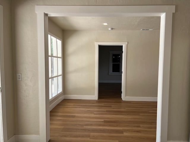 7013 N Maroa Ave, Pinedale, CA 93650 - unfurnished room featuring wood finished floors and baseboards