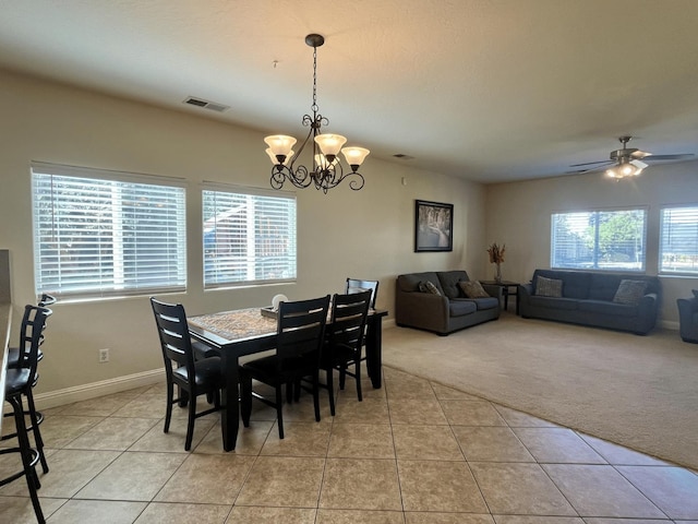 2604 W Taylor, Visalia, CA 93291 - dining space featuring light carpet, a chandelier, light tile patterned flooring, baseboards, and ceiling fan